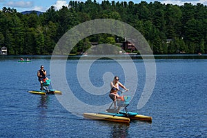 Visitors and locals enjoy summer day on Mirror Lake in Lake Placid, New York State