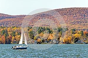 Lake Pontoosuc and sailboat, Berkshire mountains in Autumn, Pittsfield Massachusetts photo