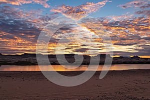 Lake Powell - Panoramic sunset view seen from Lone Rock Beach in Wahweap Bay in Lake Powell in Glen Canyon Recreation Area, Page