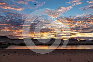 Lake Powell - Panoramic sunset view seen from Lone Rock Beach in Wahweap Bay in Lake Powell in Glen Canyon Recreation Area, Page