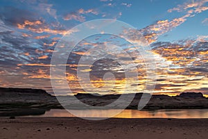 Lake Powell - Panoramic sunset view seen from Lone Rock Beach in Wahweap Bay in Lake Powell in Glen Canyon Recreation Area, Page