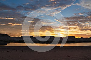 Lake Powell - Panoramic sunset view seen from Lone Rock Beach in Wahweap Bay in Lake Powell in Glen Canyon Recreation Area, Page