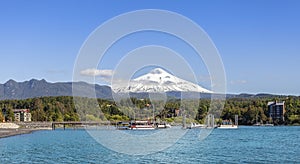 Lake in Pucon and snow covered Volcano Villarica. photo