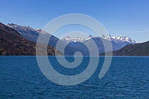 Lake Puelo with distant snow-caped mountains