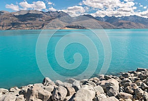 Lake Pukaki in Mackenzie Basin with Souther Alps in background, New Zealand photo