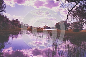 Lake with a reflection of a beautiful cloudy sky