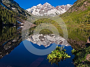 Lake reflection of the Maroon Bells near Aspen, Colorado photo