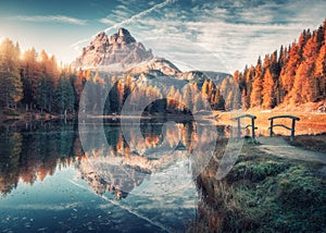 Lake with reflection in mountains at sunrise in autumn