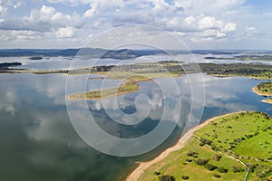 Lake reservoir water reflection drone aerial view of Alqueva Dam landscape and in Alentejo, Portugal