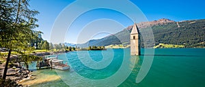 Lake Resia, Ortler mountains and church tower Alto Adige, Italy