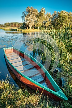 Lake Or River And Old Wooden Blue Rowing Fishing Boat At Beautiful