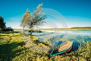 Lake Or River And Old Wooden Blue Rowing Fishing Boat At Beautiful