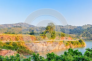 Lake, road, mountain and sky under sunshin in the morning