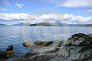 Shore with rocks on lake in National Park Tierra del Fuego with  in Patagonia, Provincia de Tierra del Fuego, Argentina photo