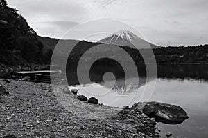 lake Saiko with floating boat and mount Fuji in morning, Yamanashi