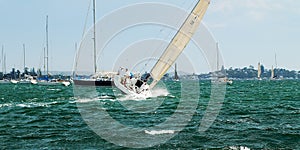 Lake Sailing and Sailboat Racing at speed in fair wind.