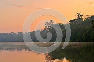 Lake Sandoval at hazy sunset in the Peruvian Amazon