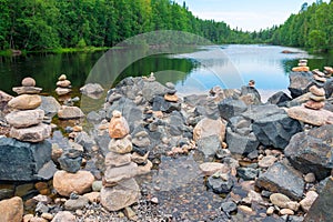 Lake with seids made of boulder stones. Karelia, Russia.