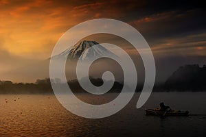 Lake Shoji and Mt. Fuji at sunrise with mist