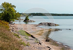 Lake shore in Durham region, lighthouse, trees