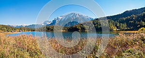 lake shore Lautersee with reed grass, Karwendel mountains, near Mittenwald