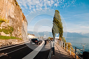 Lake side road by rock cliff in Chexbres village, Vevey, Switzerland