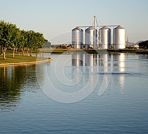 Lake with Silos in the Background