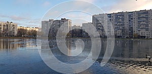 Lake in a small park in the city in a modern residential area