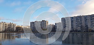 lake in a small park in the city in a modern residential area