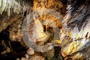 Lake and stalactites and stalagmites in Belianska cave in Slovakia