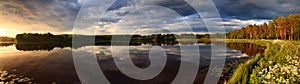 Lake at sunset panorama