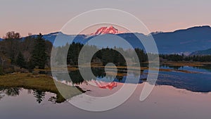 Lake surrounded by Mountains and Trees in Canadian Nature. Fall Season, Sunset Sky. Squamish BC