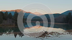 Lake surrounded by Mountains and Trees in Canadian Nature. Fall Season, Sunset Sky. Squamish BC