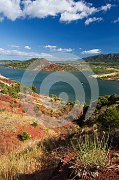 Lake surrounded by red hills