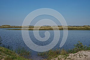 Lake Taneso, Borsmose, Vejers, Jutland, Denmark on sunny day with blue sky