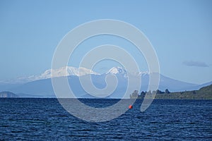 Lake Taupo with scared mountains of tongariro in background