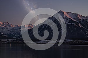 Lake Thun and the mountain Niesen during twilight.