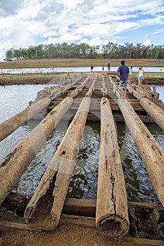 People on exposed old bridge in drought affected Lake Tinaroo