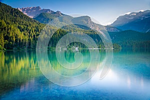 Lake Tovel reflection symmetry in Trentino-Alto Adige, Dolomites, Italy