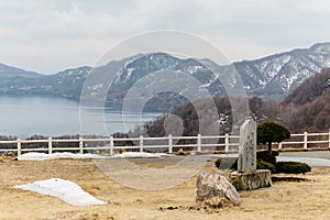 Lake Toya with snow mountain and city in winter in Hokkaido, Japan