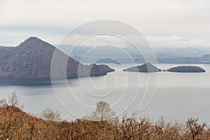 Lake Toya with snow mountain and city in winter in Hokkaido, Japan