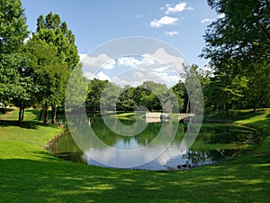 Lake and trees in community park city Plano TX USA