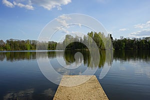 Lake with trees in the evening sunset