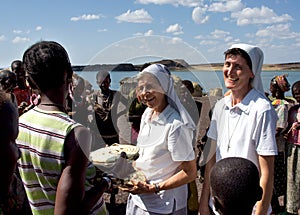 Nuns of Christian church buy handicrafts african tribe