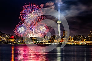 Lake Union 4th of July Fireworks and the Seattle skyline, as seen from across Elliott Bay at Seacrest Park in West Seattle