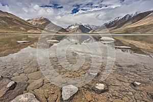 The lake on the Upper Shimshal Pass plateau where all the melted glacier water gathers to help grow the much-needed vegetation for photo