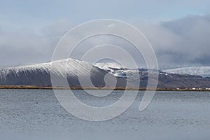 lake view of Hverfjall Crater with snow