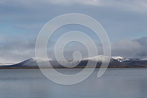 lake view of Hverfjall Crater with snow