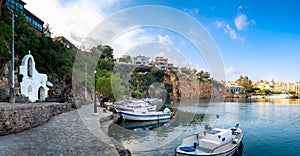 The lake Voulismeni in Agios Nikolaos, a picturesque coastal town with colorful buildings around the port in the eastern part of