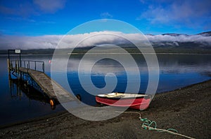 The boat docked at the lake Wakatipu photo